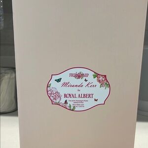 Two pink champagne flutes. Miranda Kerr for Royal Albert. With butterfly etching